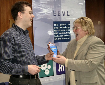 photo : (43KB) :Malcolm Moffat, EEVL Project Officer, giving a visitor a OneStep flyer at the Learning & Teaching Conference at Heriot Watt University